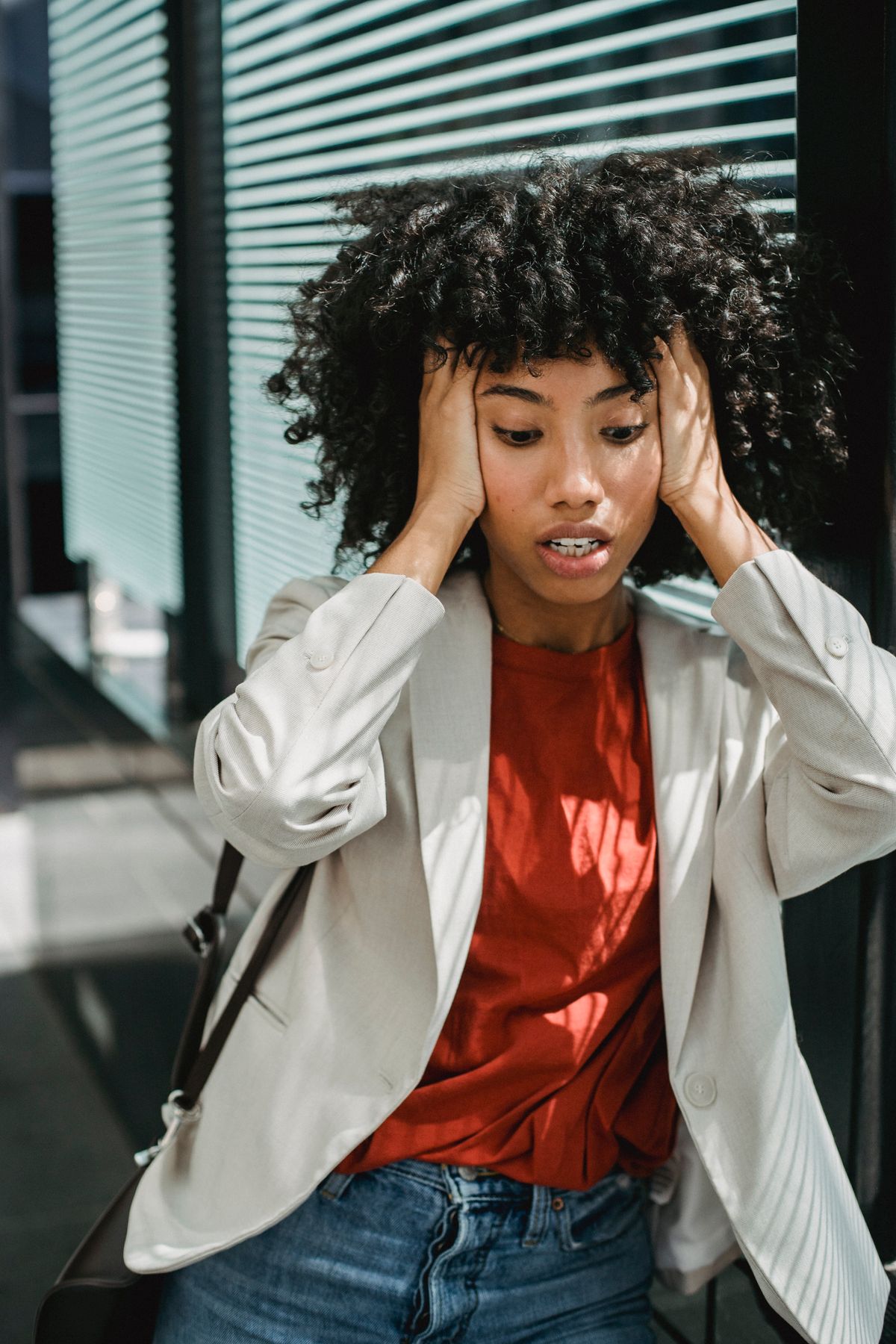 A woman holding her head during a stressful moment